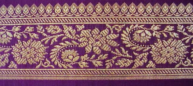 jacquard woven in gold metallic threads on a silk background